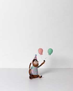 Carousel hanging circus monkey with balloons